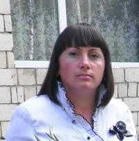 Лариса Ревуцька, вчитель 